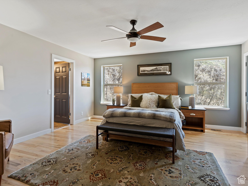 Bedroom featuring wood-type flooring and ceiling fan