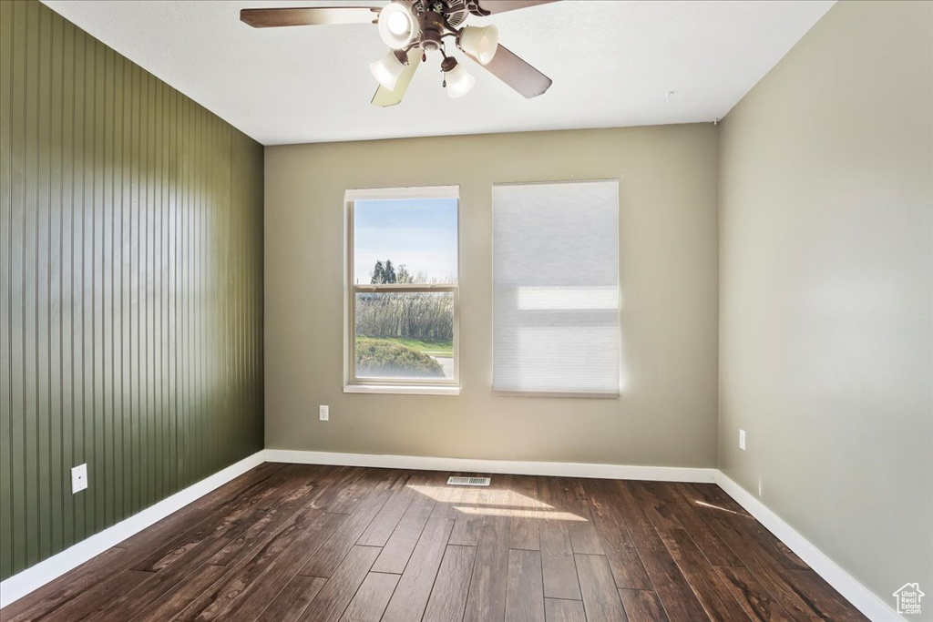 Unfurnished room featuring wood-type flooring and ceiling fan