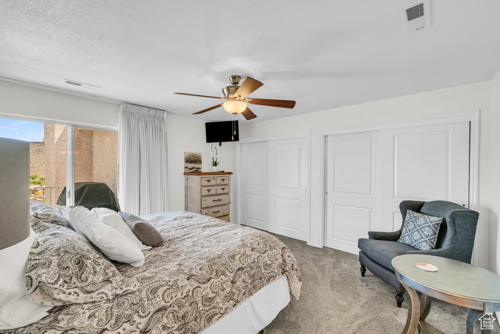 Bedroom featuring ceiling fan, access to outside, and carpet flooring