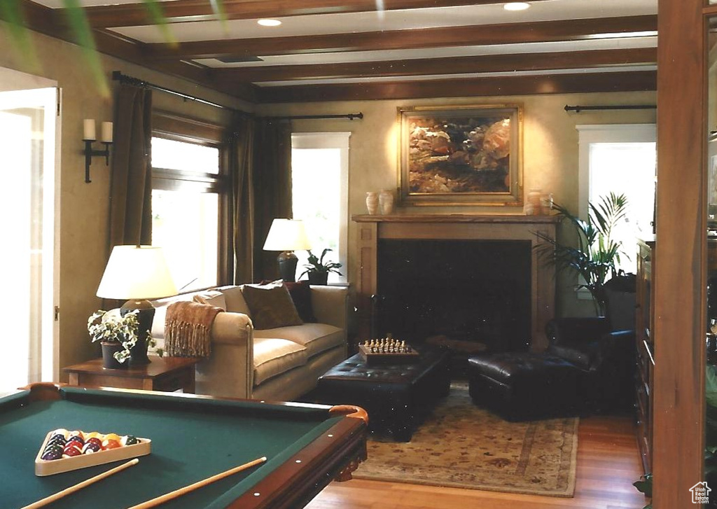 Interior space featuring hardwood / wood-style floors, beam ceiling, and billiards