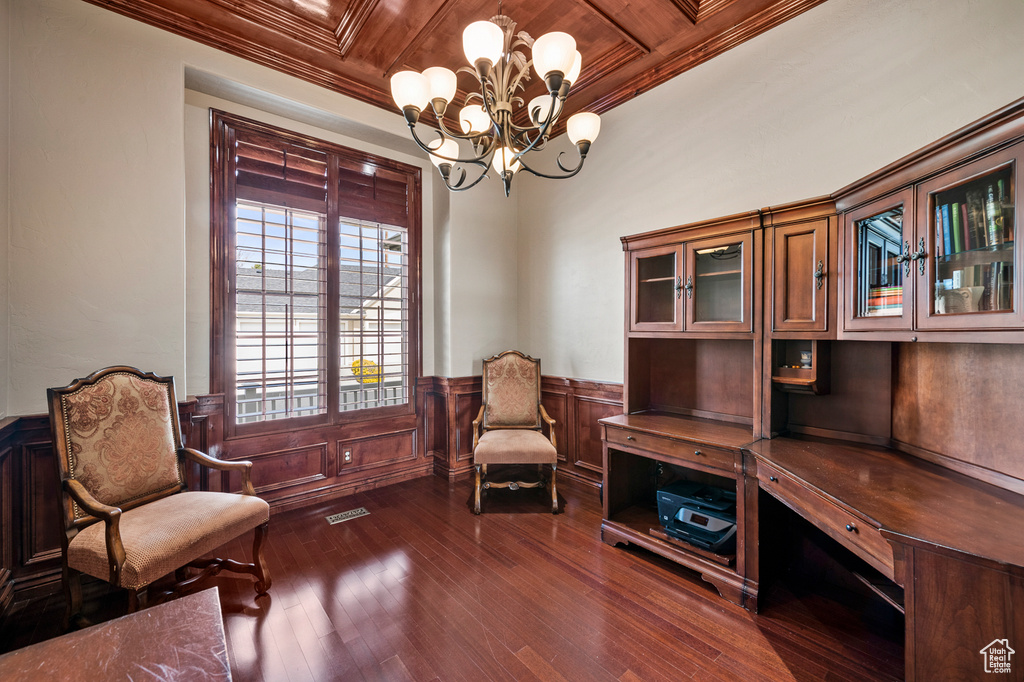 Living area featuring wooden ceiling, dark hardwood / wood-style floors, a chandelier, and ornamental molding