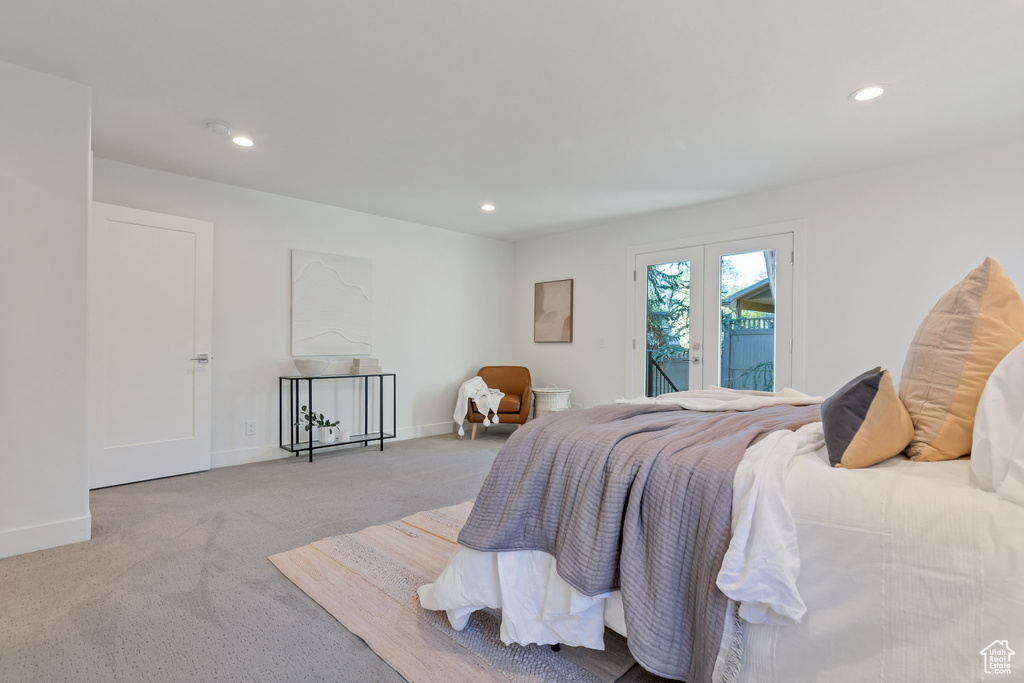 Bedroom featuring access to outside and carpet floors
