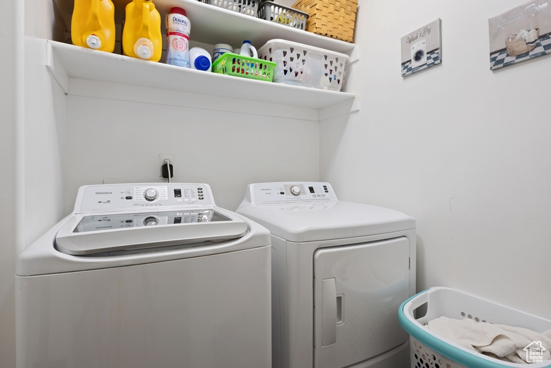 Laundry room featuring washing machine and clothes dryer