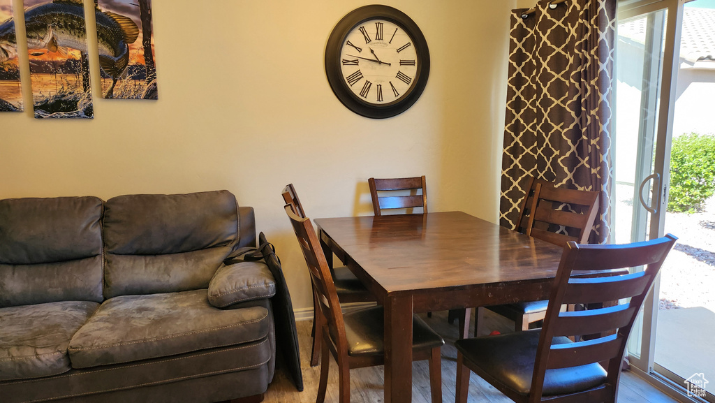 Dining space featuring wood-type flooring and plenty of natural light