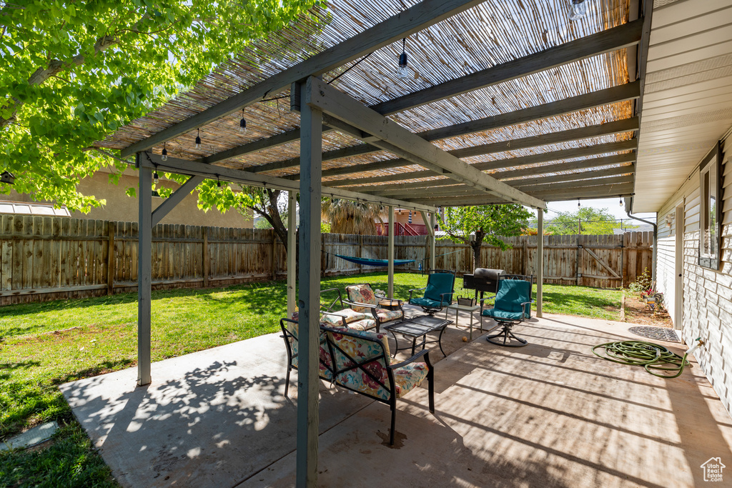 View of patio / terrace with a trampoline and a pergola