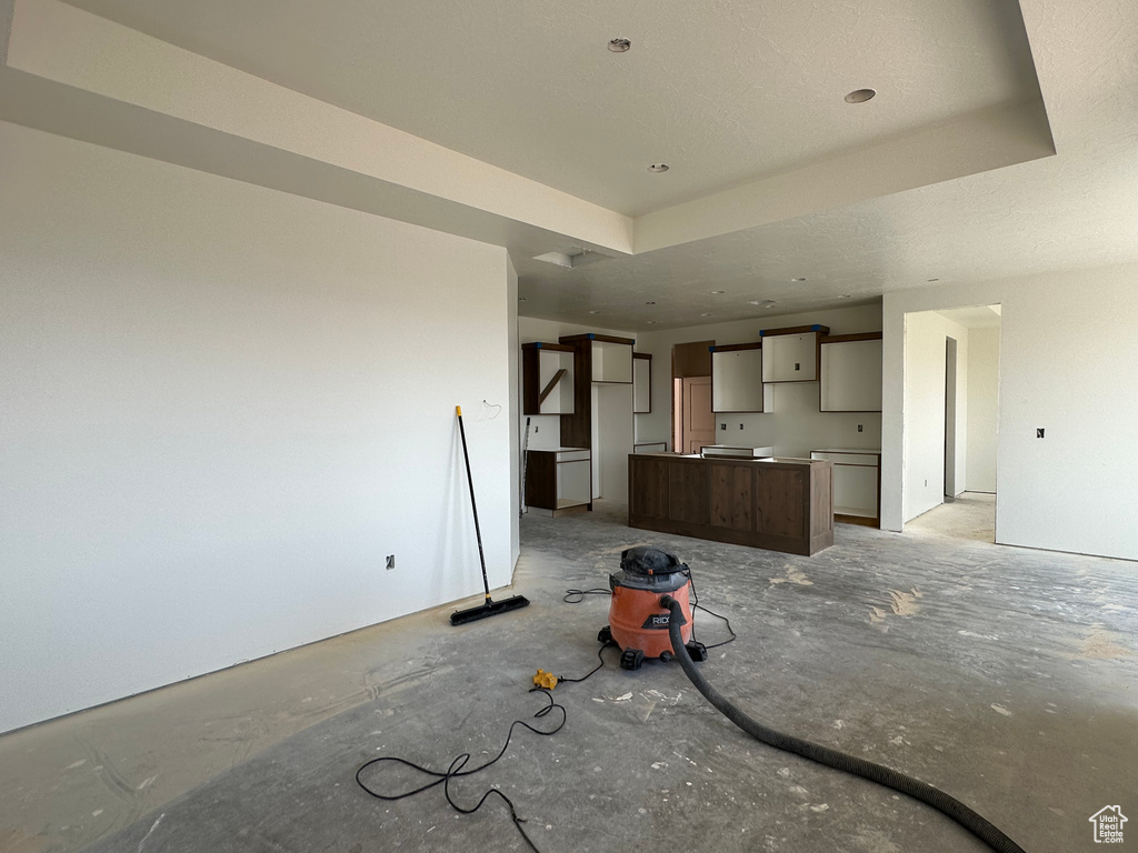 Unfurnished living room featuring a textured ceiling