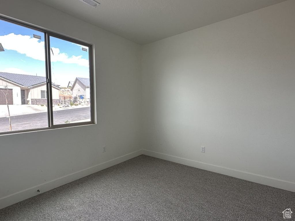 Empty room featuring carpet floors