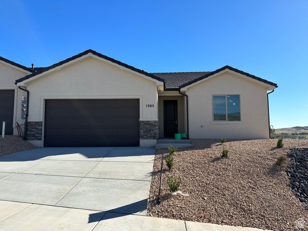 Single story home with a garage