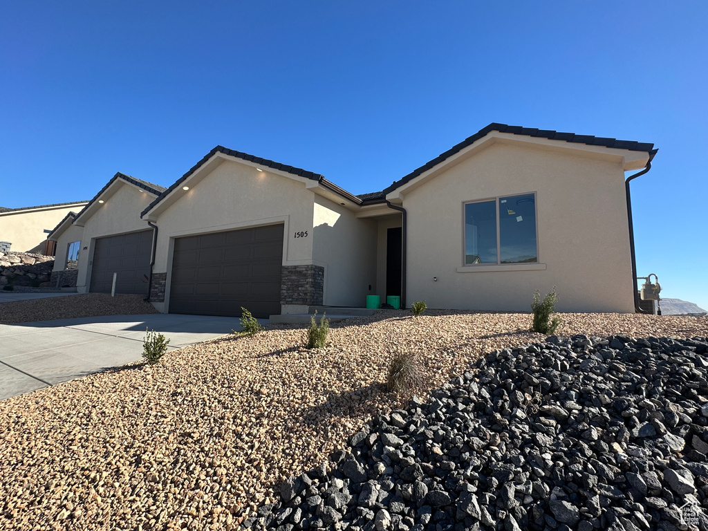 Single story home with a garage