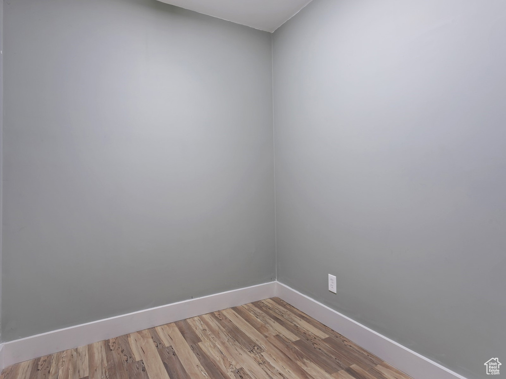 Unfurnished room featuring wood-type flooring