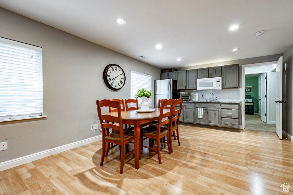 Dining area featuring light hardwood / wood-style floors and sink