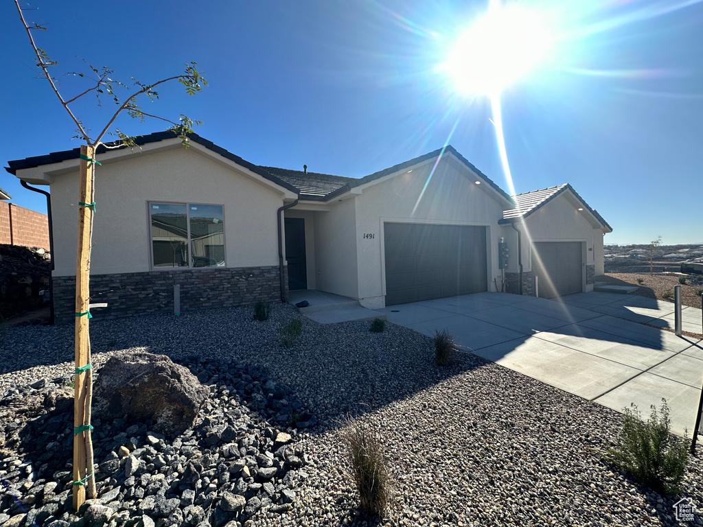 Ranch-style home featuring a garage