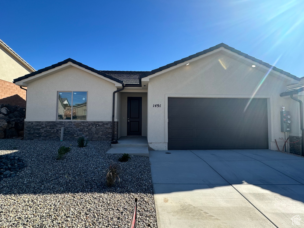 Single story home with a garage