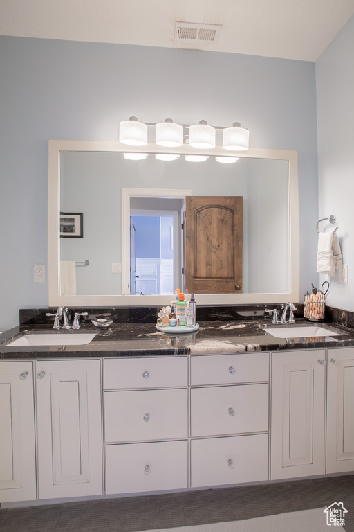 Bathroom with large vanity and double sink
