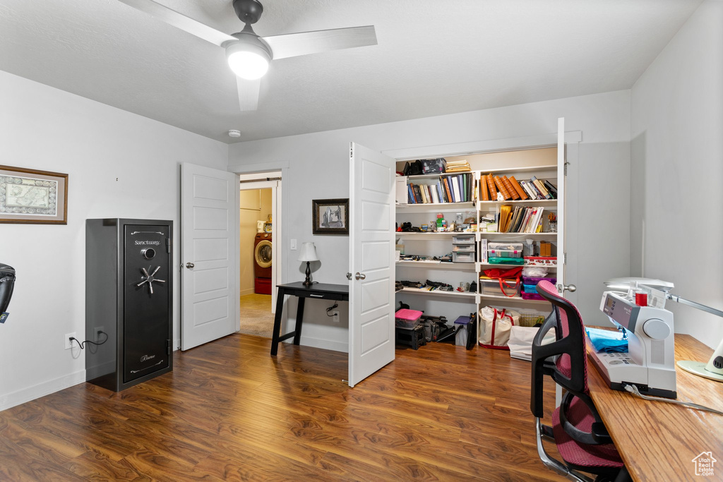 Office featuring ceiling fan, dark hardwood / wood-style floors, and washer / dryer