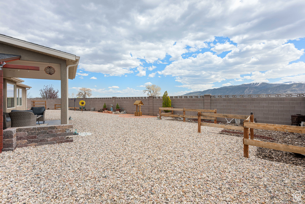View of yard featuring a patio area and a mountain view