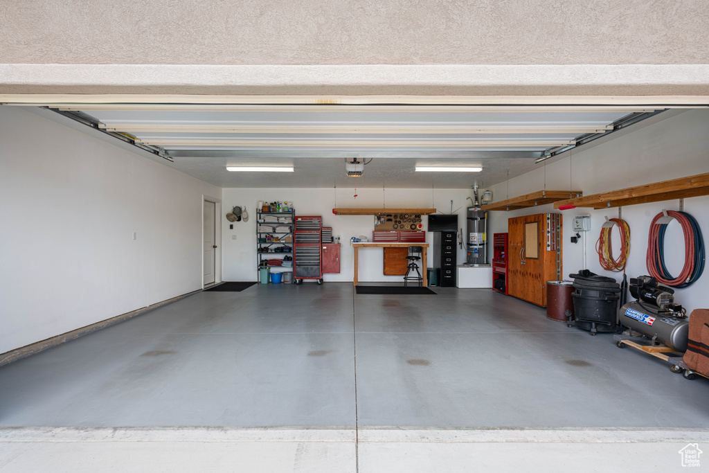 Garage with secured water heater and a garage door opener