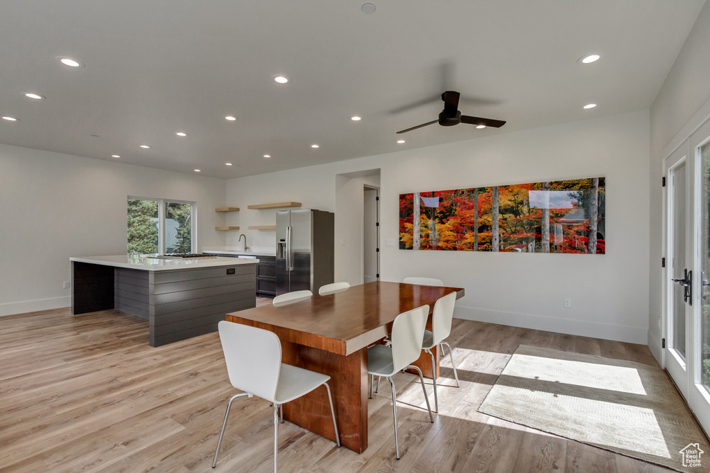Dining space featuring light hardwood / wood-style flooring and ceiling fan