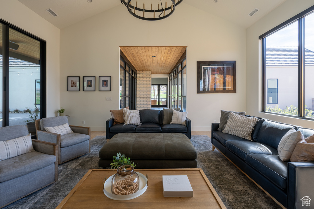 Living room featuring a wealth of natural light and vaulted ceiling