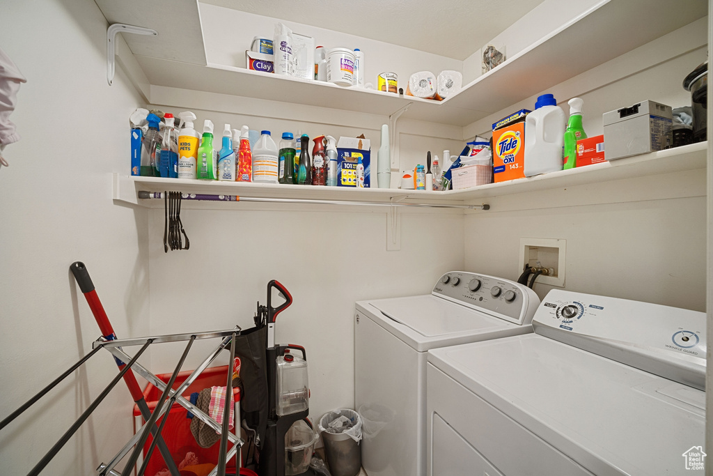 Laundry area with washer hookup and washing machine and clothes dryer