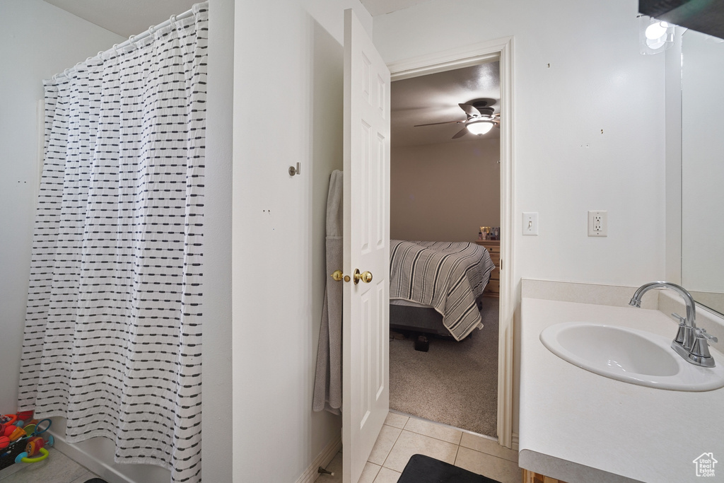Bathroom with ceiling fan, vanity, and tile flooring