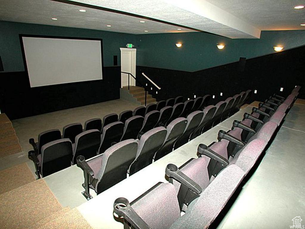 Cinema room featuring a textured ceiling