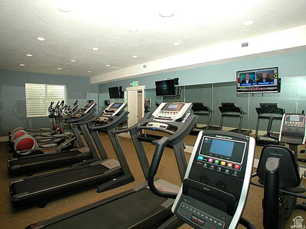 Workout area featuring a textured ceiling