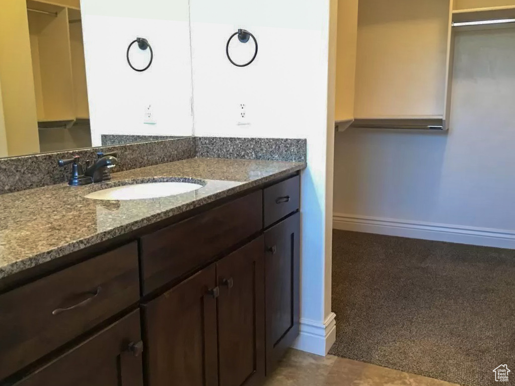 Bathroom with vanity and tile flooring