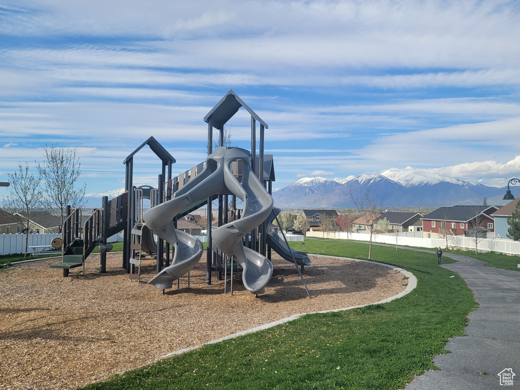View of jungle gym with a mountain view