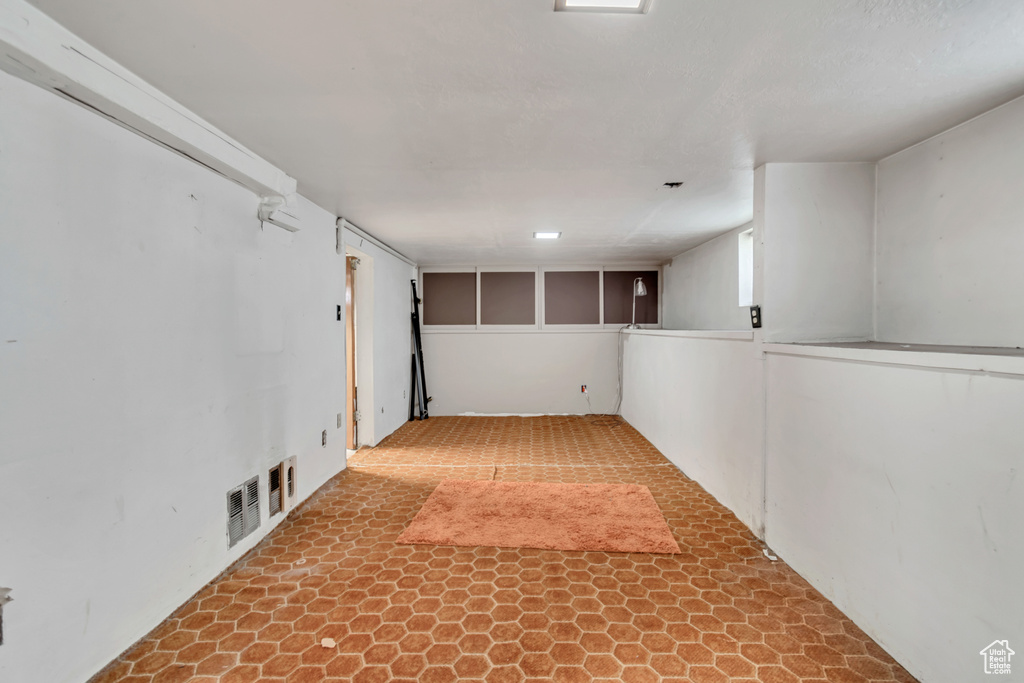 Interior space featuring light tile floors