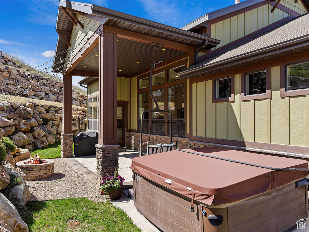Exterior space featuring a hot tub