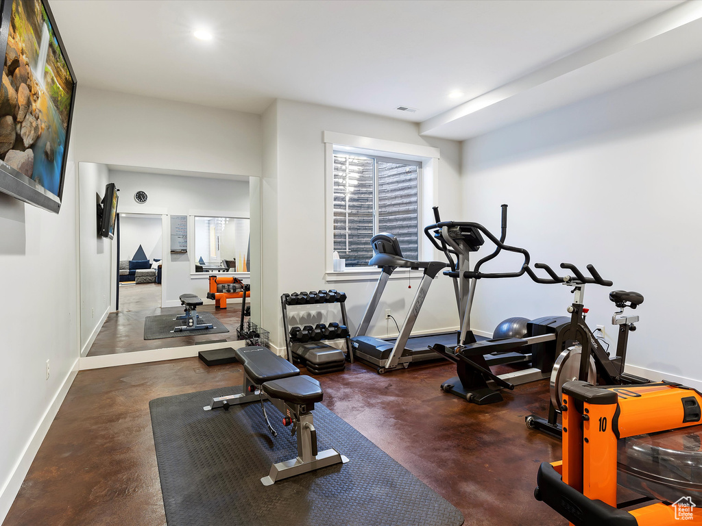 Exercise room with concrete flooring
