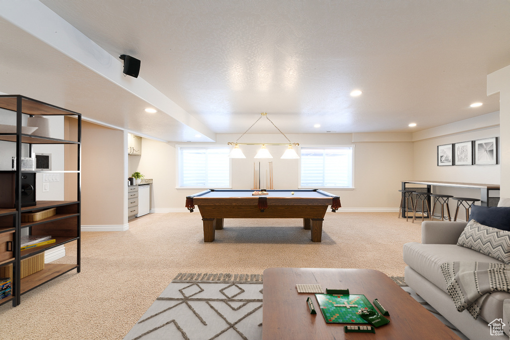 Playroom with a healthy amount of sunlight, billiards, and carpet