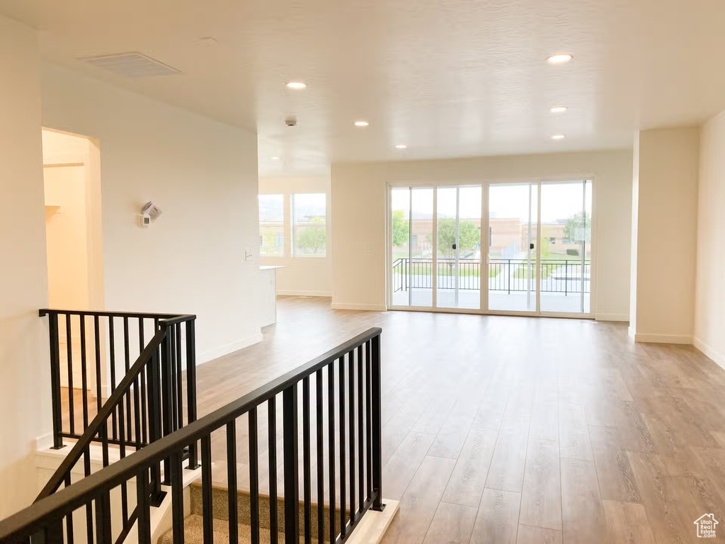 Corridor featuring light wood-type flooring