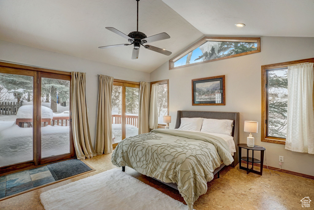 Bedroom with multiple windows, ceiling fan, and access to outside