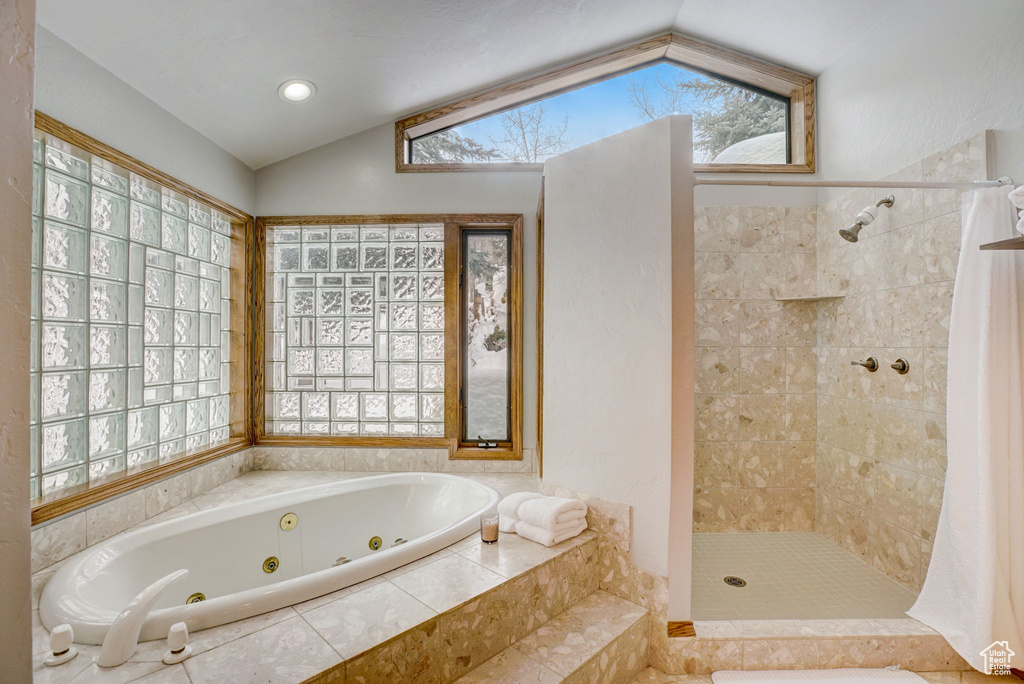Bathroom with vaulted ceiling and plus walk in shower