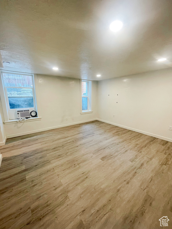 Basement featuring hardwood / wood-style floors