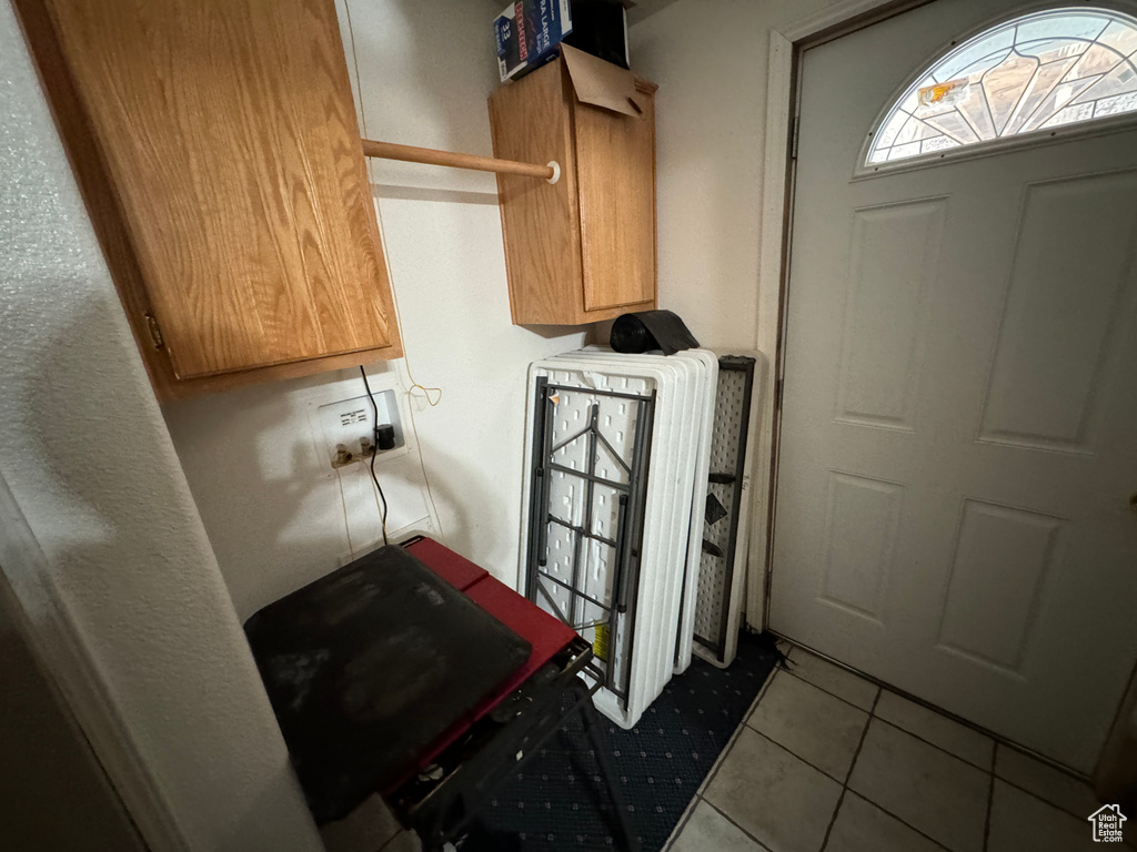 Laundry room with tile floors