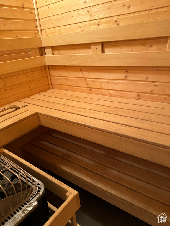 View of sauna / steam room with wooden ceiling and wood walls