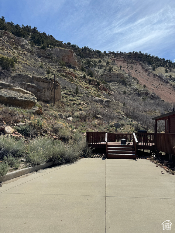 View of patio featuring a deck with mountain view