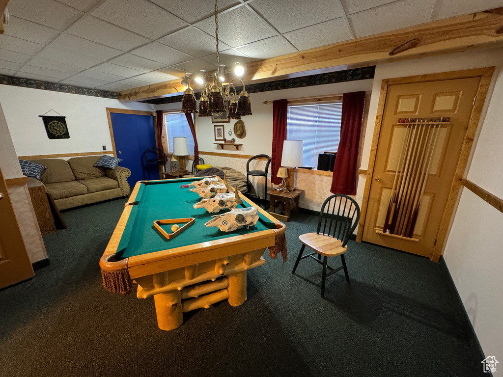 Rec room with dark colored carpet, pool table, and a paneled ceiling