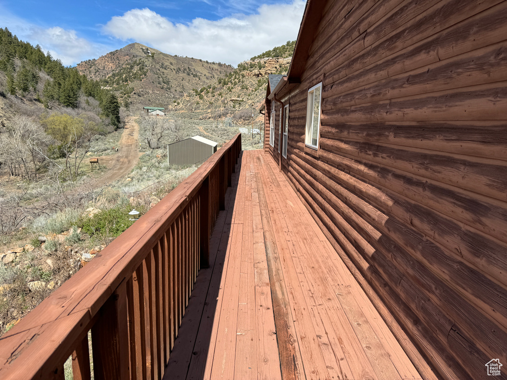 Wooden terrace featuring a mountain view