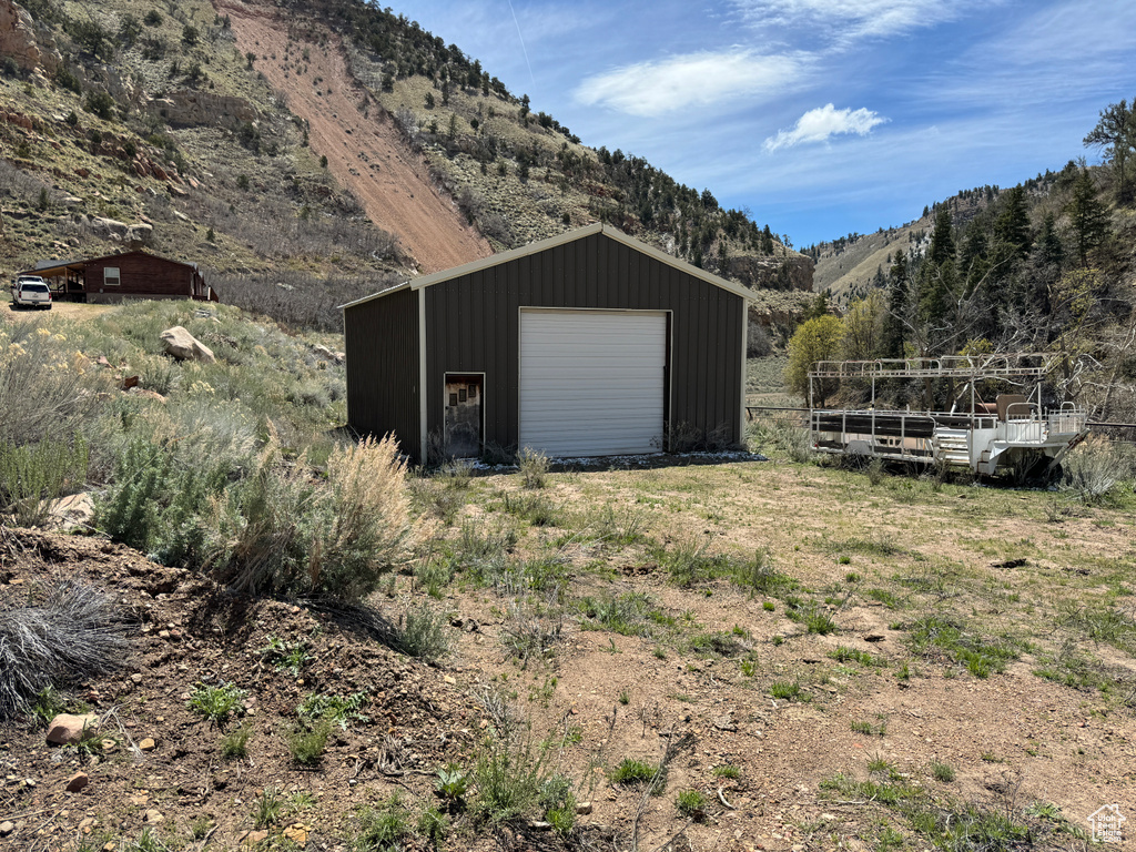 Garage featuring a mountain view