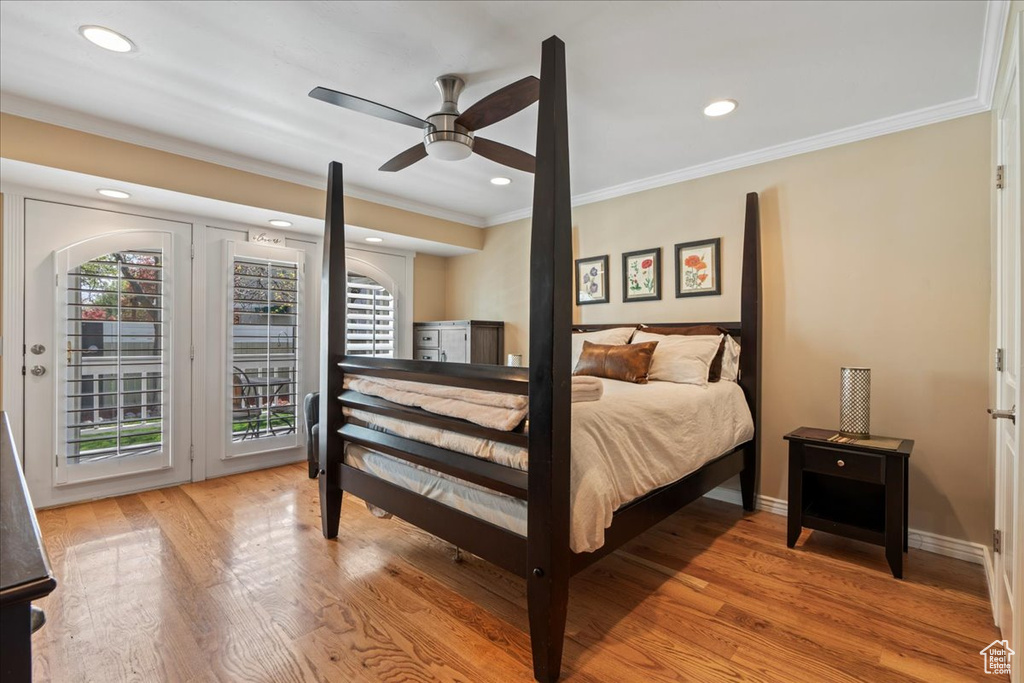 Bedroom with hardwood / wood-style flooring, crown molding, ceiling fan, and access to outside
