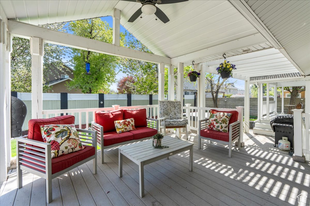 Deck with ceiling fan and an outdoor hangout area
