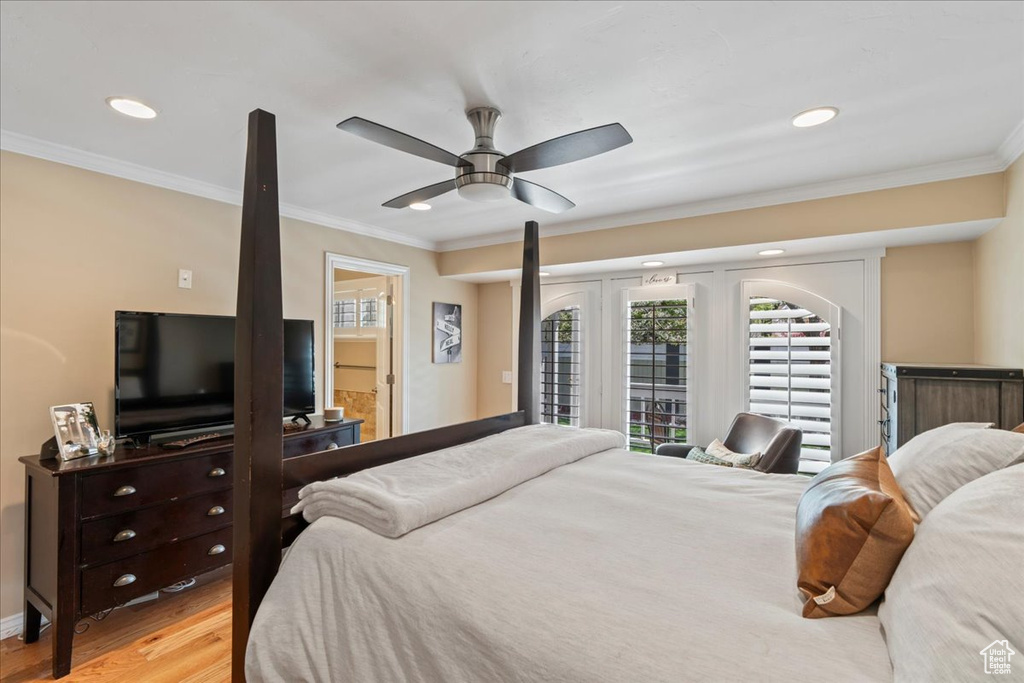 Bedroom with ceiling fan, crown molding, light wood-type flooring, and access to exterior