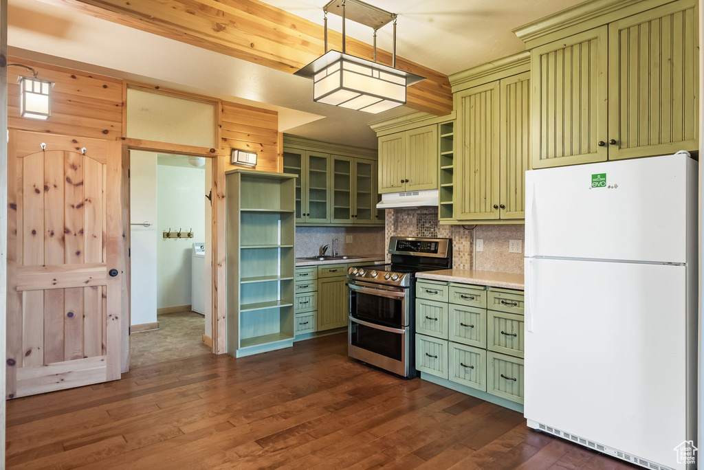 Kitchen featuring white refrigerator, stainless steel electric range, green cabinetry, and dark wood-type flooring