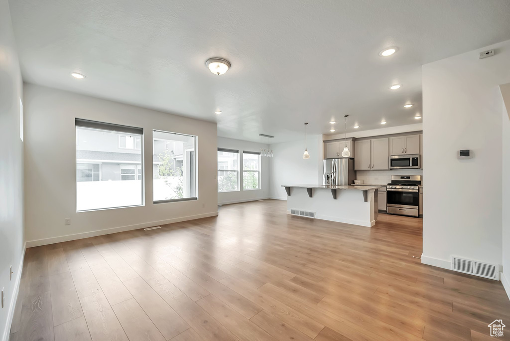 Unfurnished living room with light hardwood / wood-style flooring