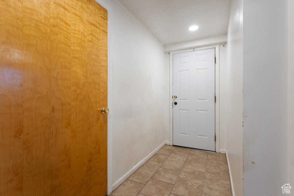 Entryway with light tile floors