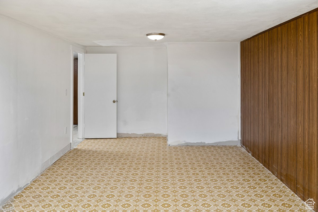 Empty room with light tile floors